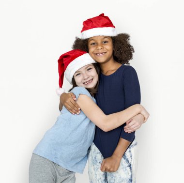 Noel Baba şapkaları sarılma kızlarda