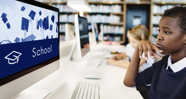 Boy looking at monitor screen — Stock Photo, Image