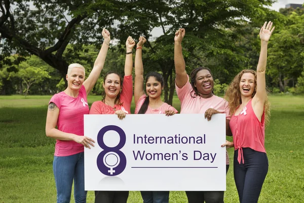 Five smiling women holding banner — Stock Photo, Image