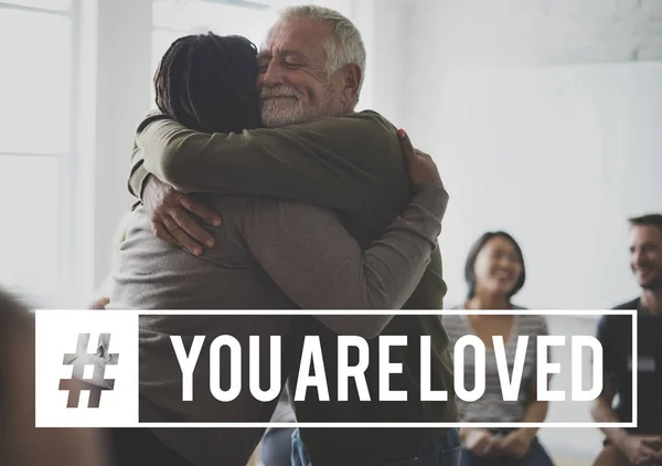 Man hugging woman at seminar — Stock Photo, Image