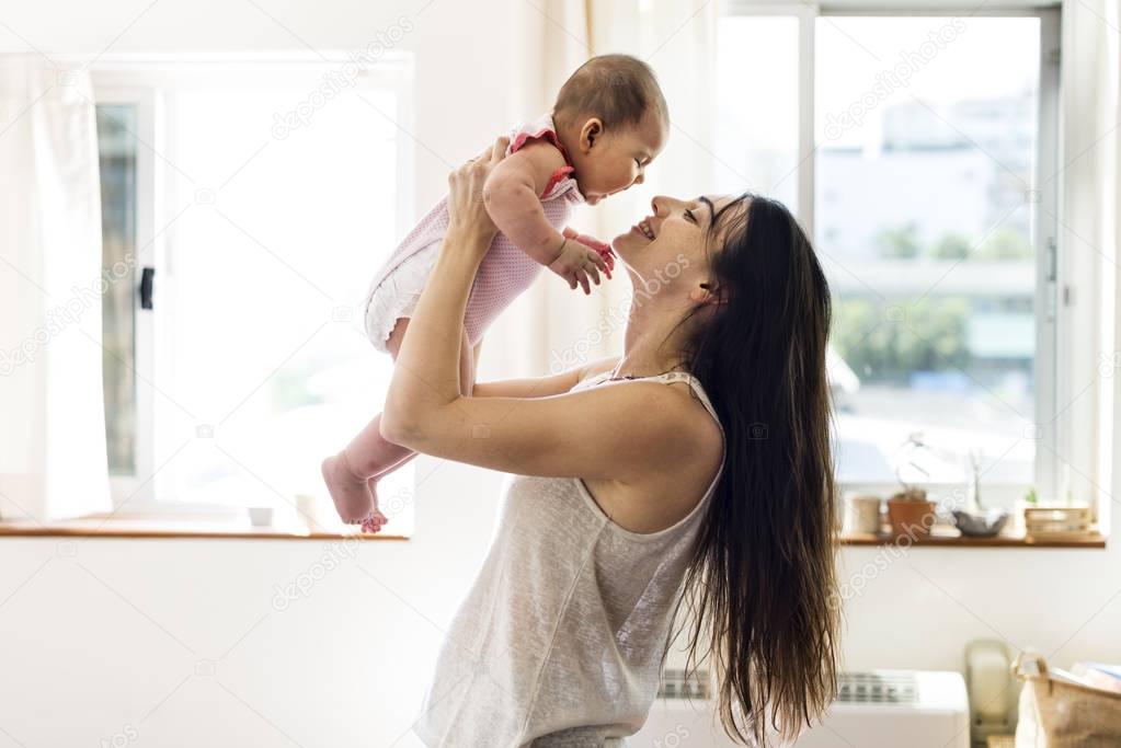 mother holding newborn baby