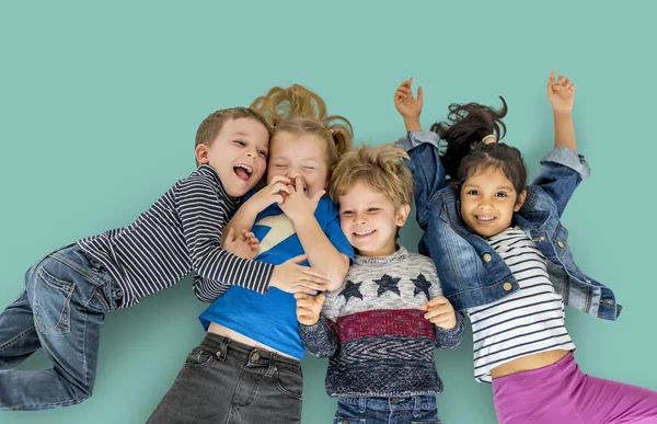 Adorable children laying on floor — Stock Photo, Image