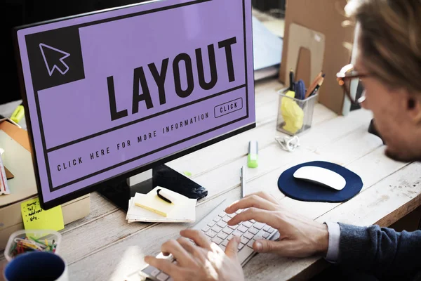 Man sitting against computer — Stock Photo, Image