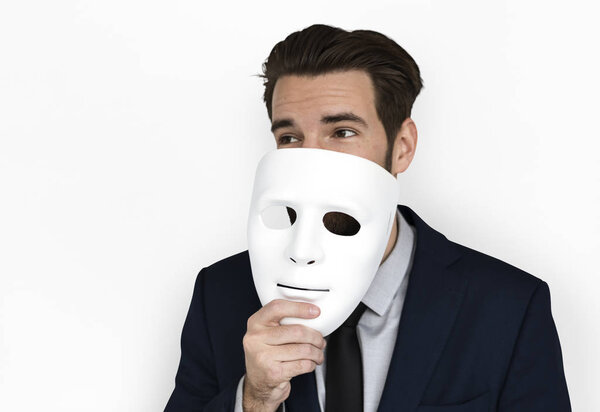Business man holding mask