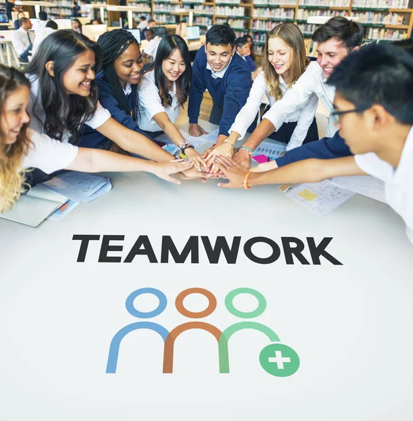 Students making stack of hands — Stock Photo, Image