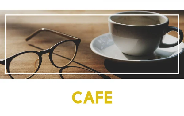 Coffee cup and eyeglasses — Stock Photo, Image