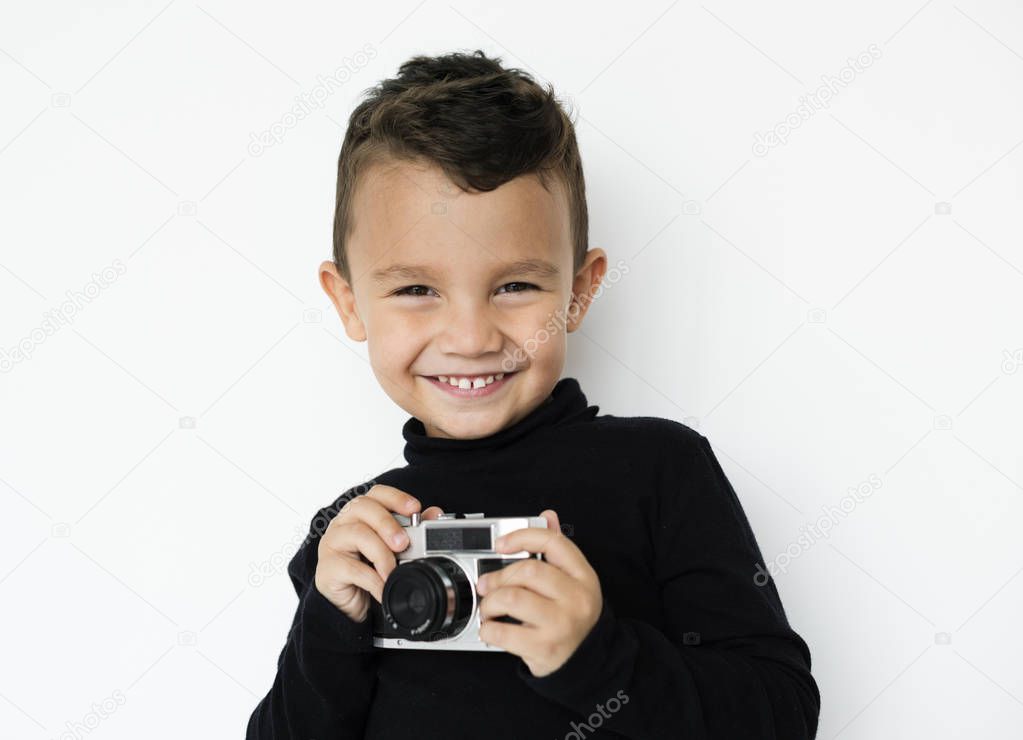 boy holding camera 