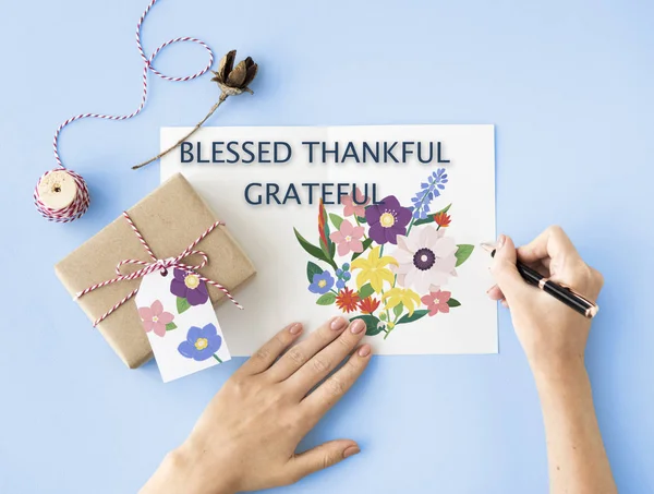 Woman writing greeting card — Stock Photo, Image