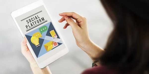 woman holding digital tablet