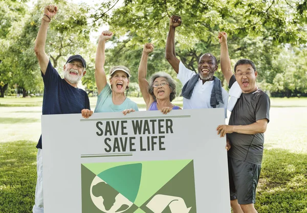 People holding informational board — Stock Photo, Image