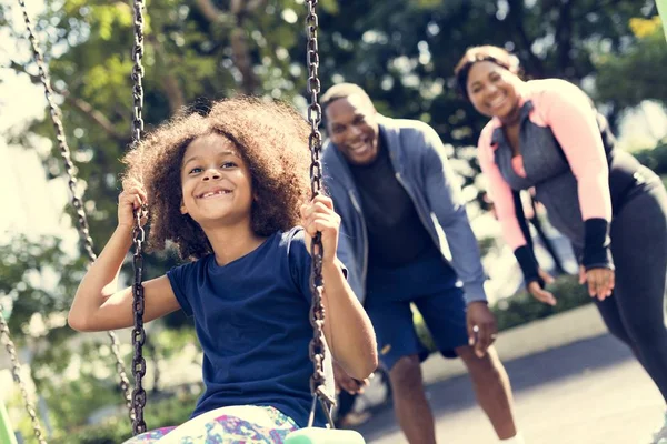 Girl swinging on swing — Stock Photo, Image