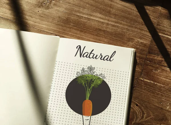 Wooden table and opened text book — Stock Photo, Image