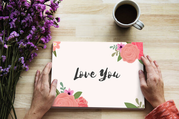 hands holding opened book