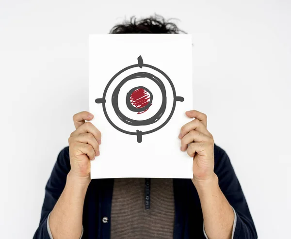 Man holding card with target — Stock Photo, Image