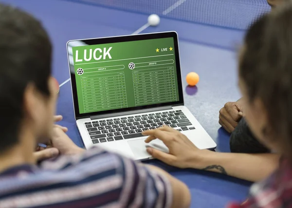 People sitting against laptop — Stock Photo, Image