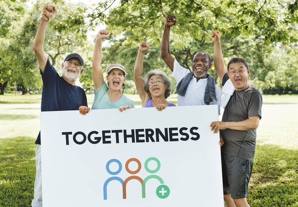 people holding informational board