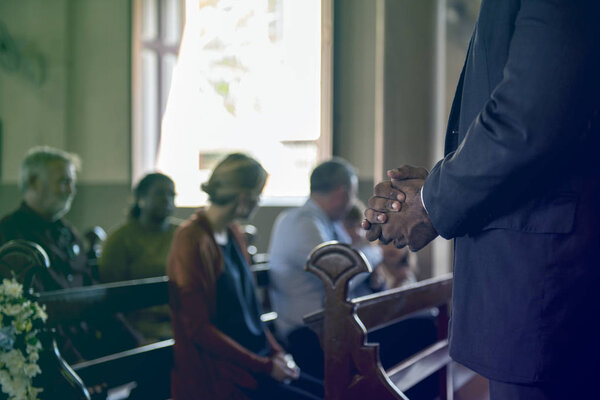 People praying in the Church