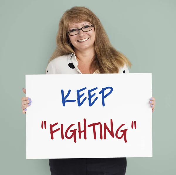 Woman holding placard — Stock Photo, Image