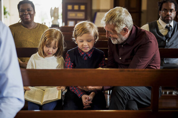 Family praying in the Church