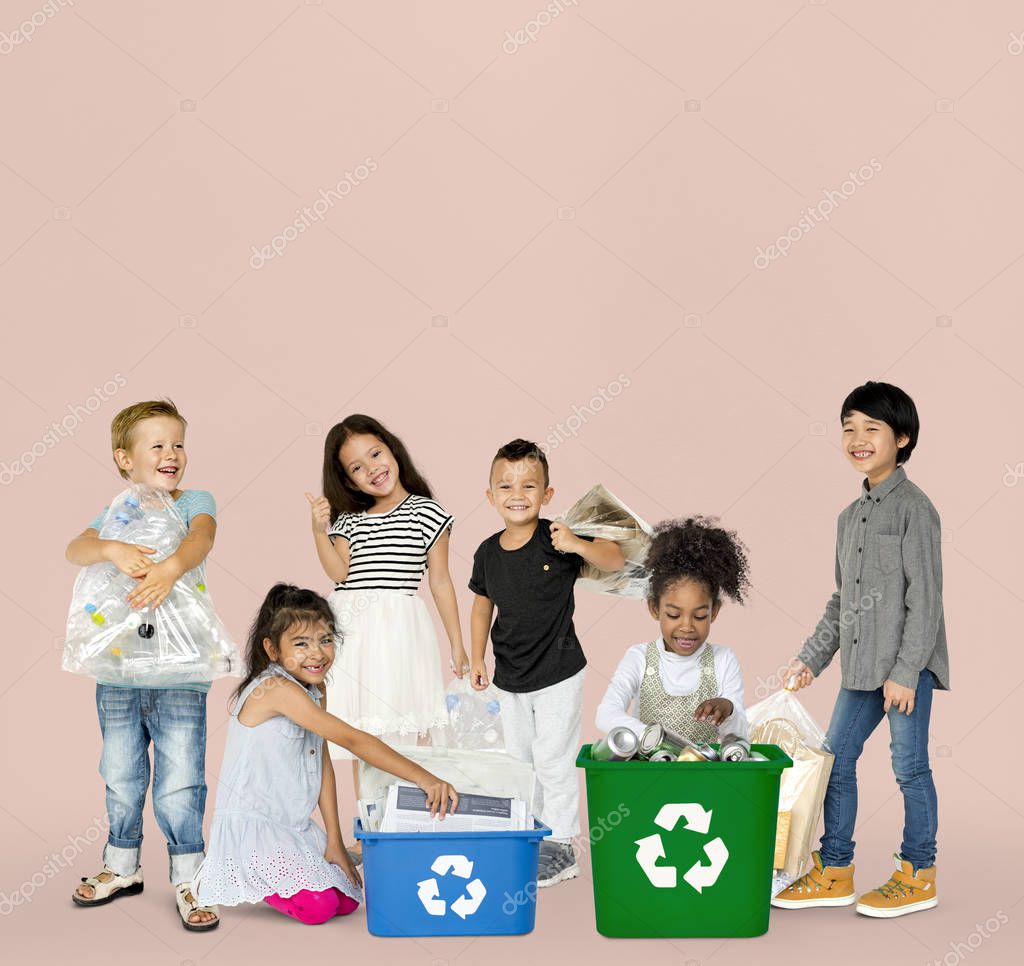 Diverse Group Of Kids Recycling Garbage