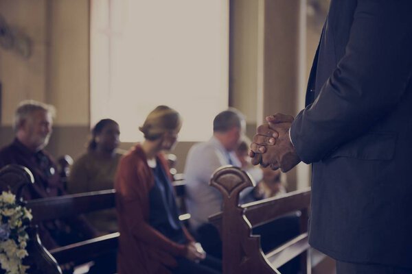People praying in the Church