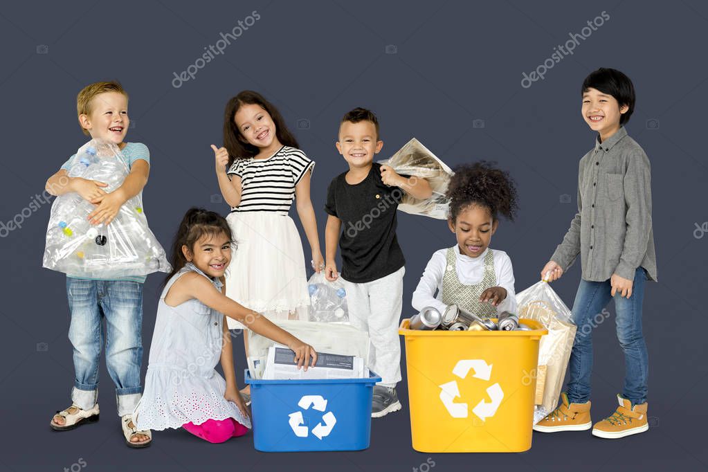 Diverse Group Of Kids Recycling Garbage