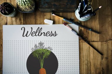 Masanın üzerinde albüm ve Boya fırçaları