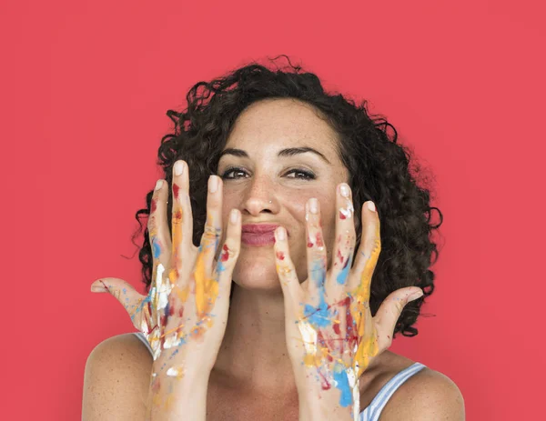 Woman with hands in colorful paint — Stock Photo, Image
