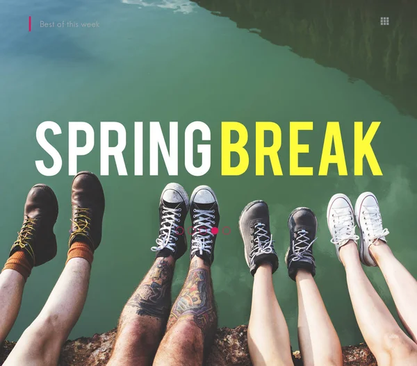 Four pairs of legs above green lake — Stock Photo, Image