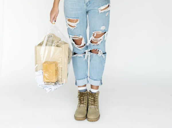 Woman holding plastic bag — Stock Photo, Image