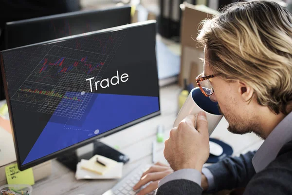 Man sitting against computer — Stock Photo, Image