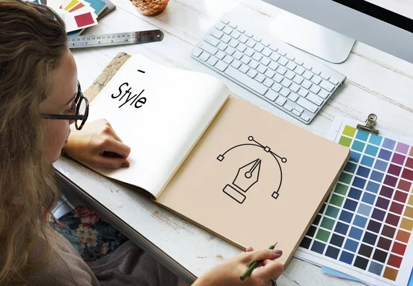 Designer drawing in album — Stock Photo, Image