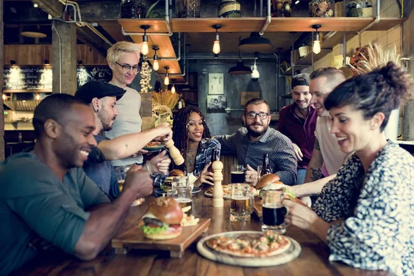 Diverse People Hanging Out in Pub