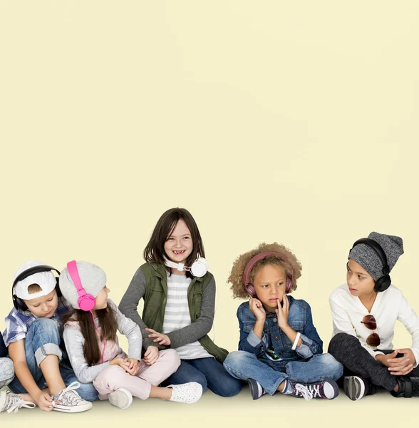Multicultural kids in headphones — Stock Photo, Image