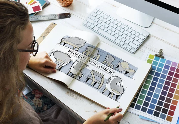 Designer drawing in album — Stock Photo, Image