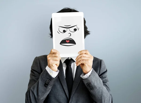 Business man covering face with digital tablet — Stock Photo, Image