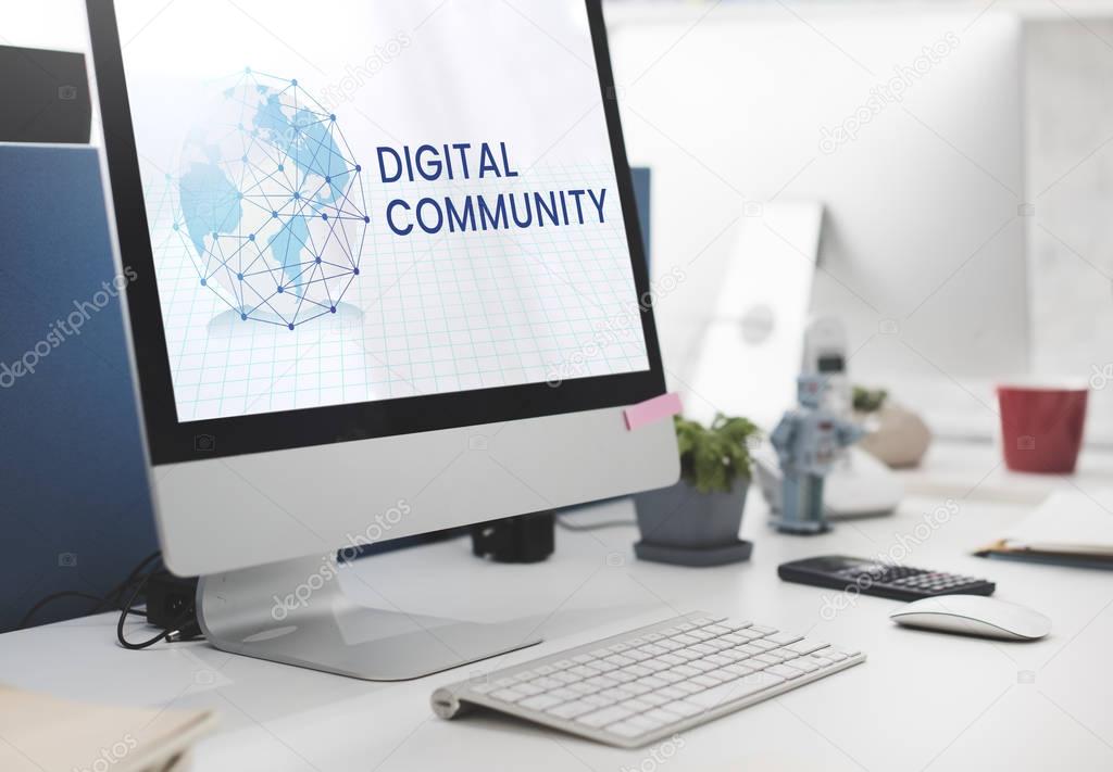 Computer on work table with Digital Community concept