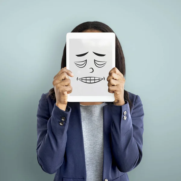 Business woman covering face with digital tablet — Stock Photo, Image