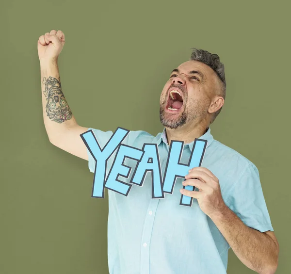 Man holding papercraft yeah word — Stock Photo, Image