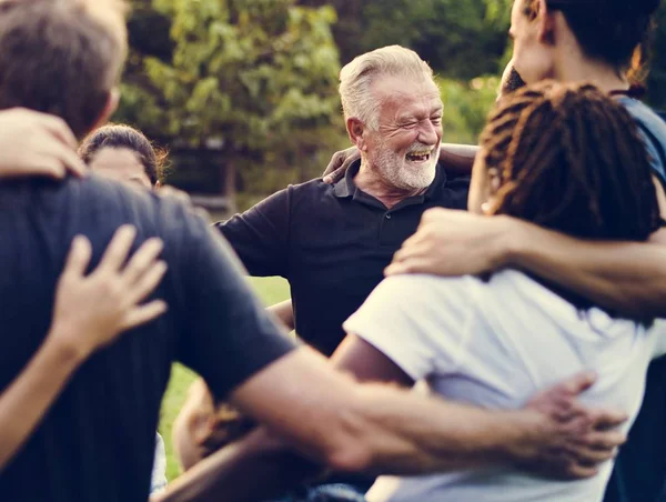 People huddle and smiling together — Stock Photo, Image