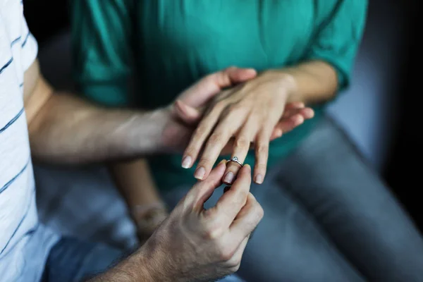 Man putting ring on finger — Stock Photo, Image