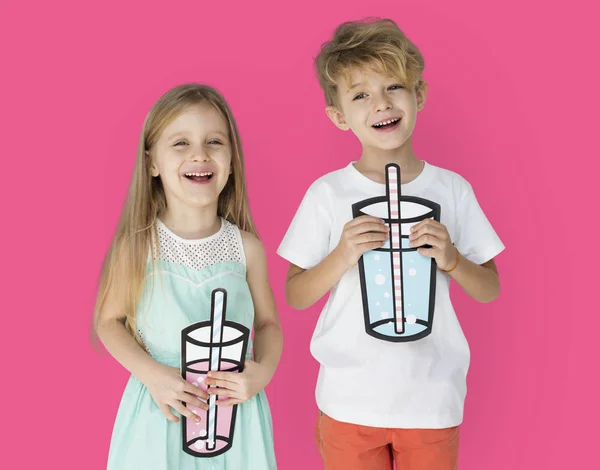 KIds Holding Paper Drinks Stock Image