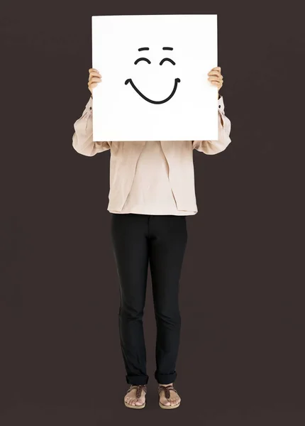 Persona che copre il viso con cartello bianco — Foto Stock