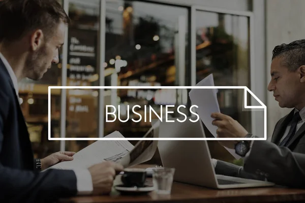 Businessmen reading newspapers in coffee shop — Stock Photo, Image