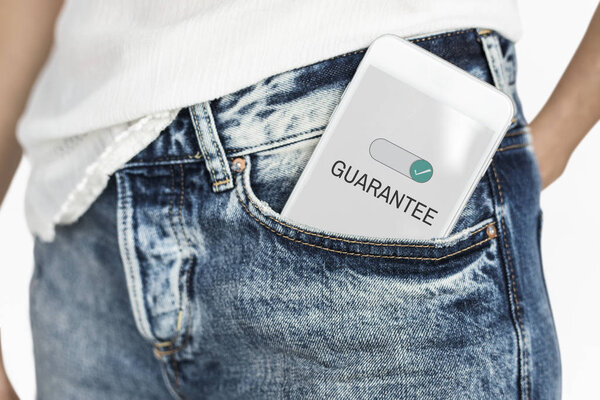 person with smartphone in pocket