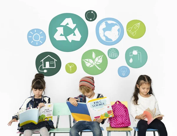 school children sitting on chairs