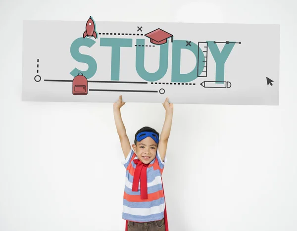 Niño en traje superhéroe sostiene pancarta —  Fotos de Stock