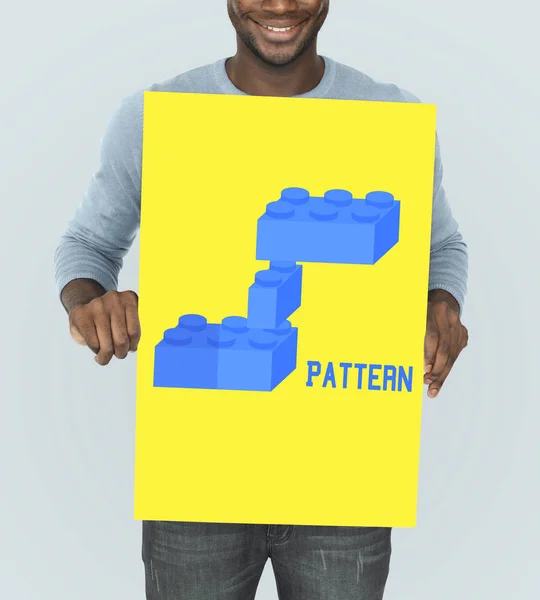 African man holding graphic banner — Stock Photo, Image