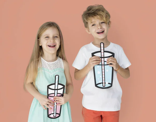 KIds Holding Paper Drinks Stock Image