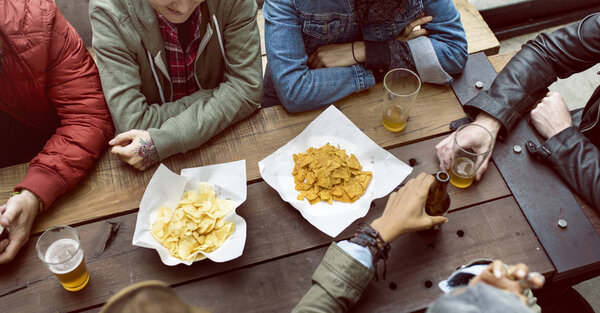 Diverse People Hanging Out in Pub